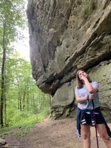 girl posing by rock wall in red river gorge ky